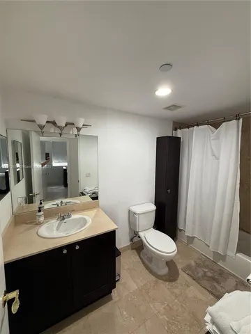 a bathroom with a sink and a shower