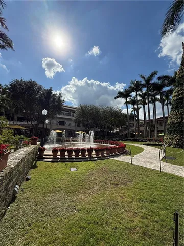 a view of a swimming pool with a yard