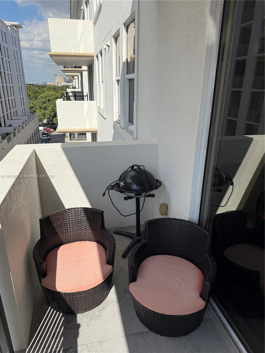 4100 Salzedo Street, Unit 811 Coral Gables, FL 33146 - Photo 9 of 28 a view of a room with furniture and wooden floor