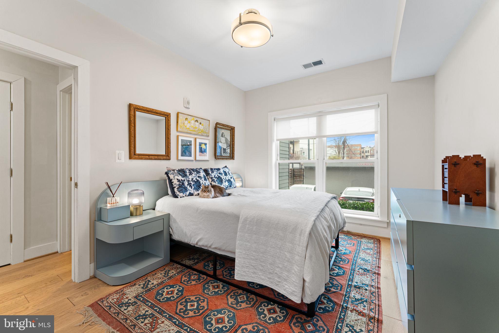 3435 14th Street Northwest, Unit 3 Washington, DC 20010 - Photo 11 of 19 a bedroom with a bed and a window