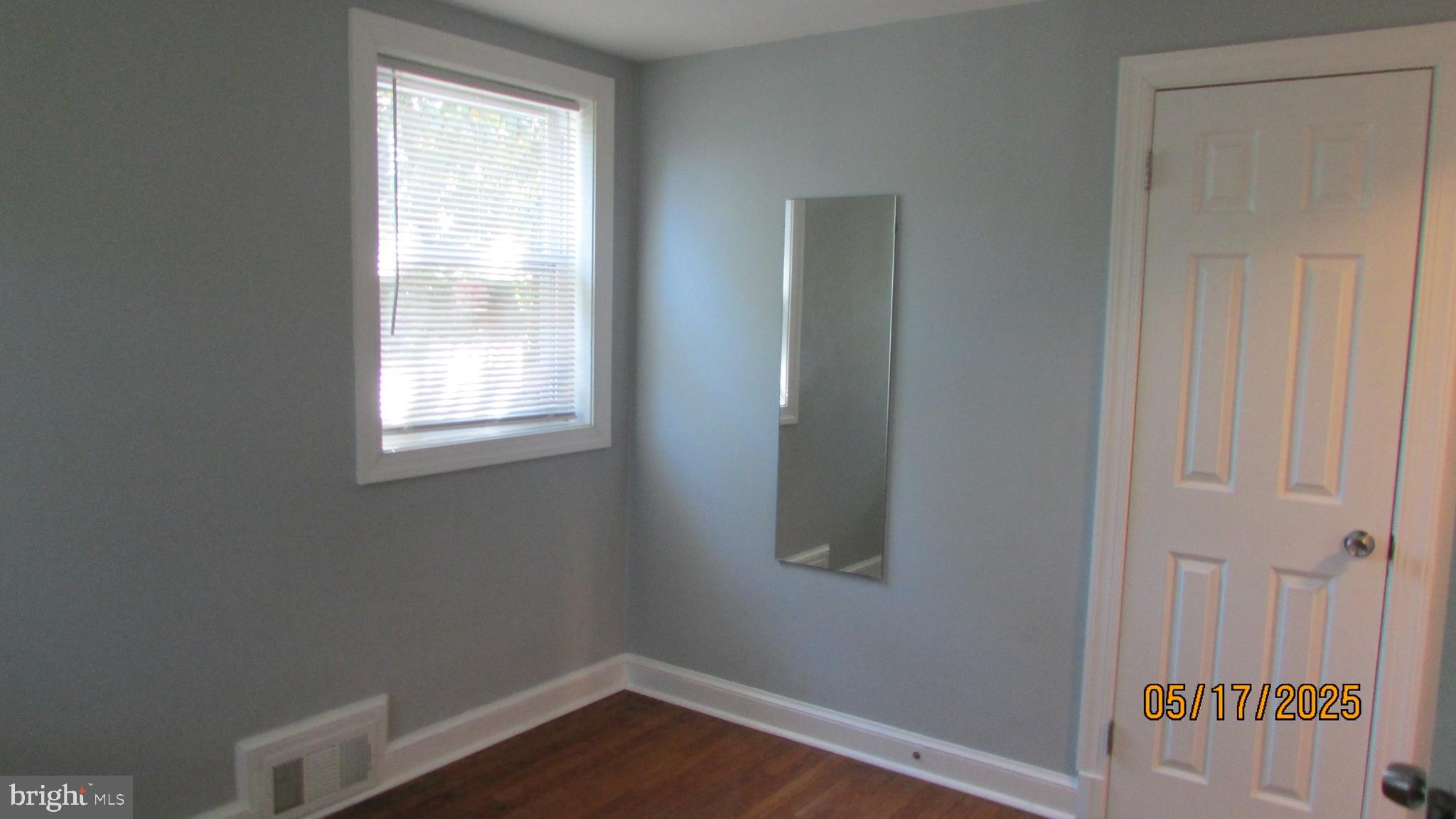 5901 Taylor Road Riverdale, MD 20737 - Photo 22 of 24 an empty room with a window