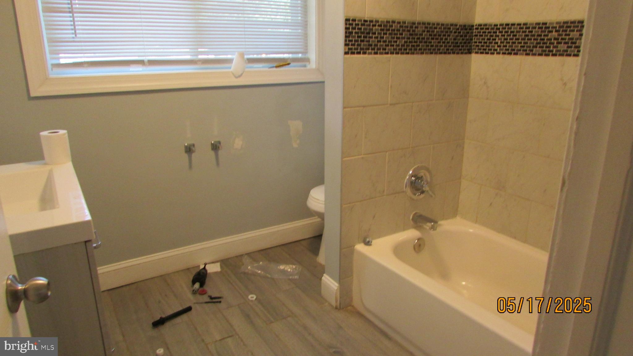 5901 Taylor Road Riverdale, MD 20737 - Photo 8 of 24 a bathroom with a bathtub and shower