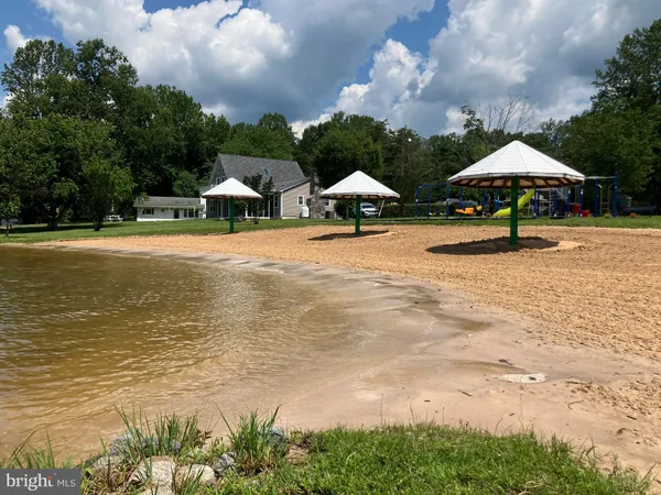 a view of a lake with houses in the back