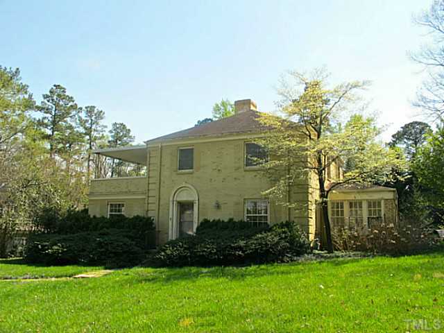 1918 Banbury Road Raleigh, NC 27608 - Photo 1 of 12 a front view of a house with a yard and trees