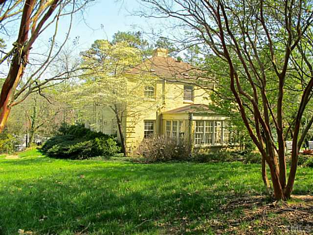 1918 Banbury Road Raleigh, NC 27608 - Photo 12 of 12 a view of a house next to a big yard and large trees