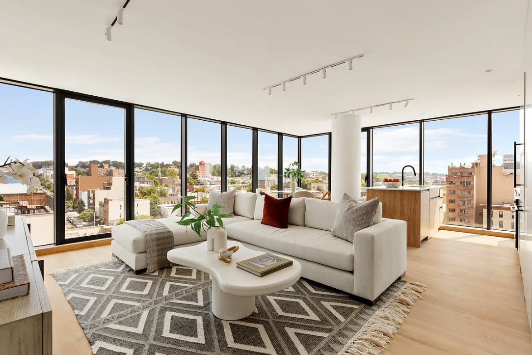 179 20th Street, Unit 9B Brooklyn, NY 11232 - Photo 2 of 13 a living room with furniture and a large window