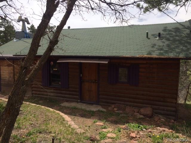 7865 Marriott Road Cascade, CO 80809 - Photo 1 of 5 a front view of a house
