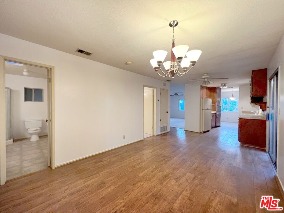 192 Valley Road Oak View, CA 93022 - Photo 9 of 34 a view of a kitchen with a sink and dishwasher kitchen view with wooden floor