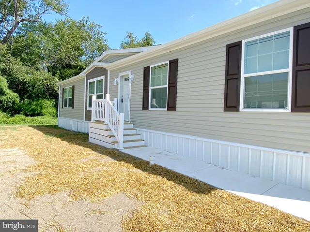a front view of a house with a patio