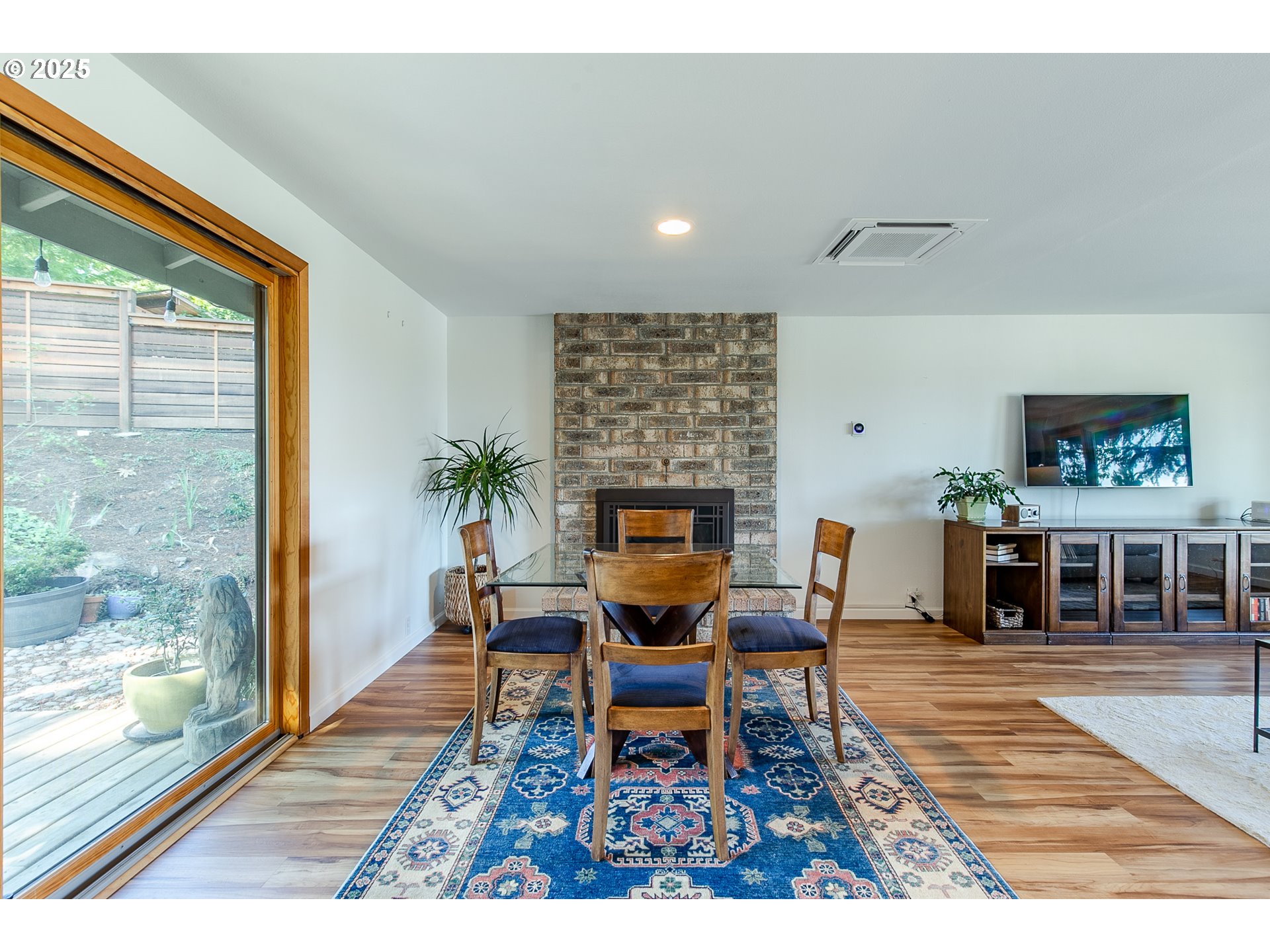 2724 Malibu Way Eugene, OR 97405 - Photo 14 of 48 a living room with furniture a rug and a fireplace