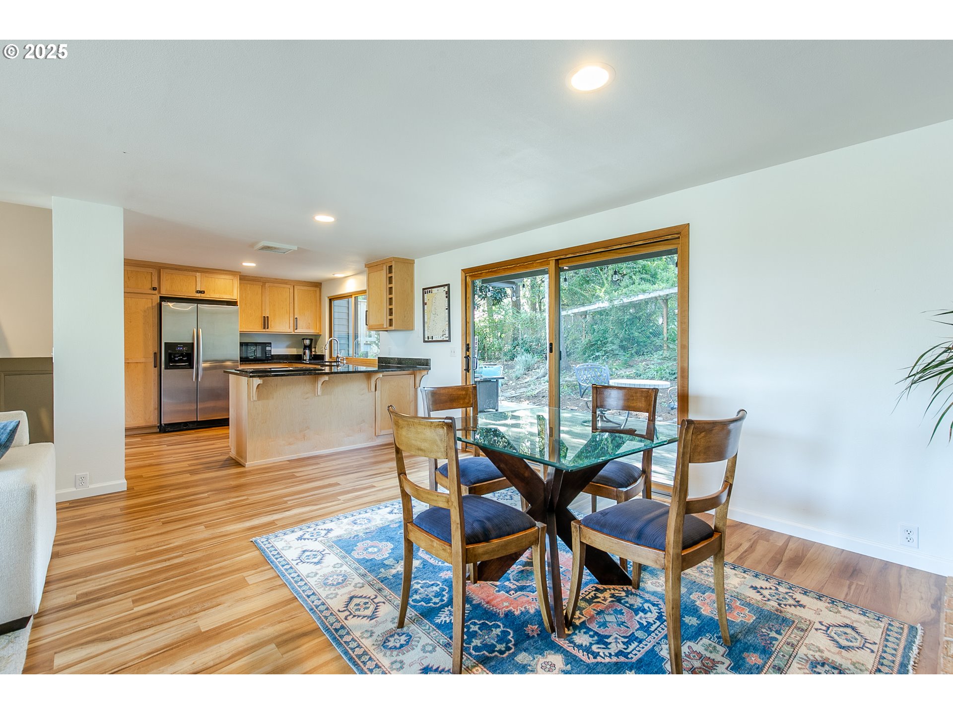 2724 Malibu Way Eugene, OR 97405 - Photo 16 of 48 a dining room with furniture and wooden floor