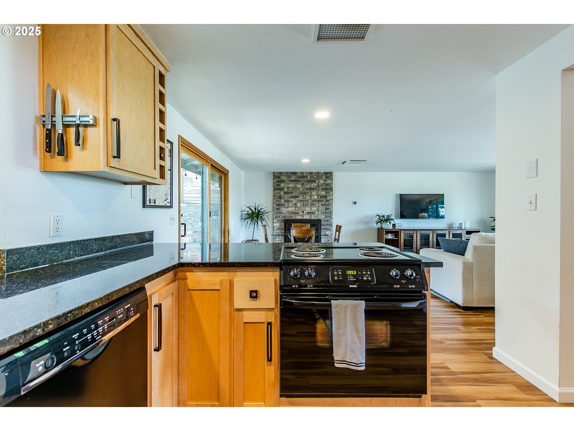 2724 Malibu Way Eugene, OR 97405 - Photo 19 of 48 a kitchen with stainless steel appliances granite countertop a stove and a sink