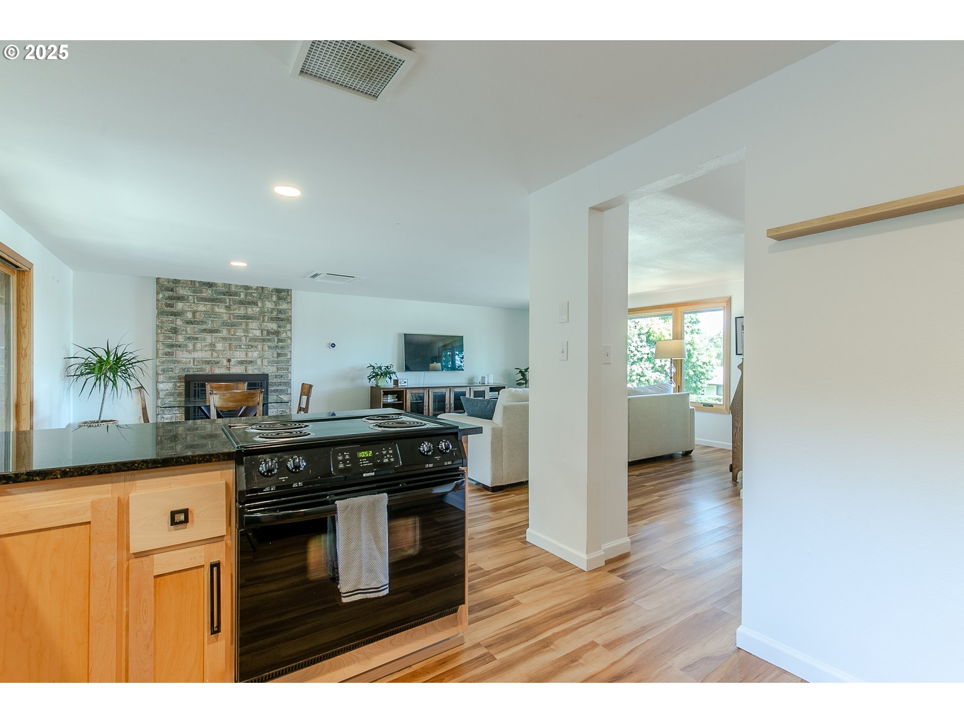 2724 Malibu Way Eugene, OR 97405 - Photo 23 of 48 a kitchen with granite countertop a stove top oven