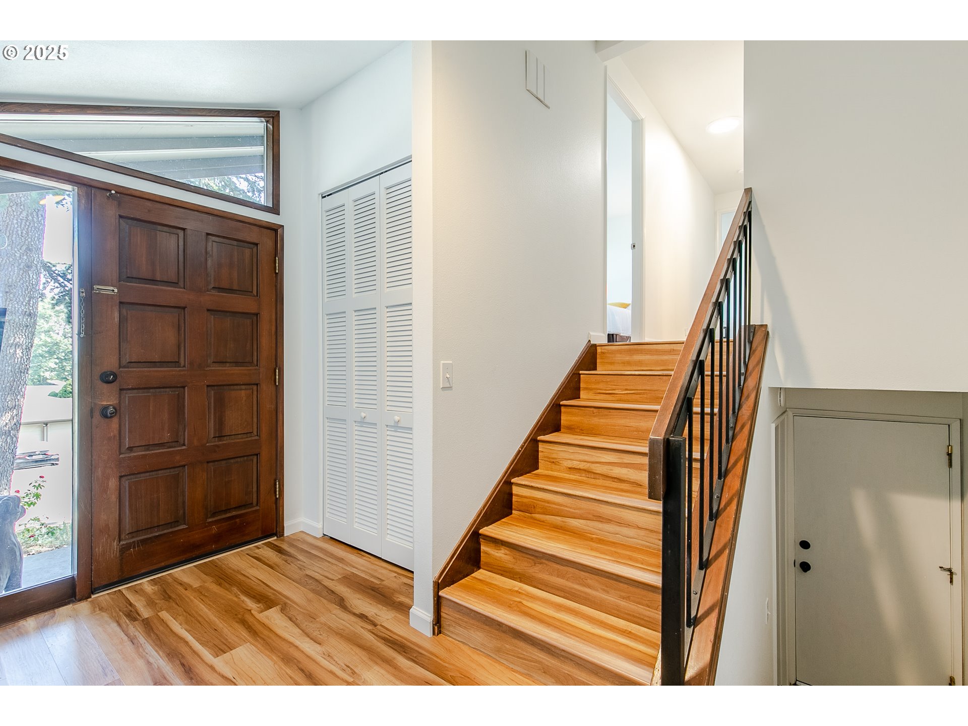 2724 Malibu Way Eugene, OR 97405 - Photo 24 of 48 a view of entryway with stairs and wooden floor