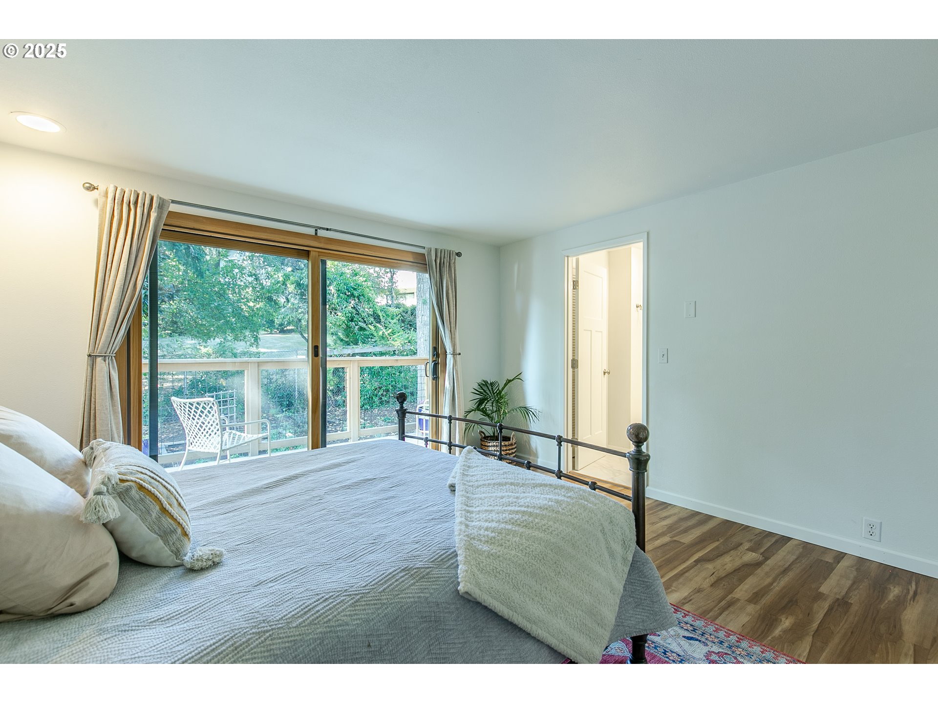 2724 Malibu Way Eugene, OR 97405 - Photo 27 of 48 a living room with furniture large window and wooden floor