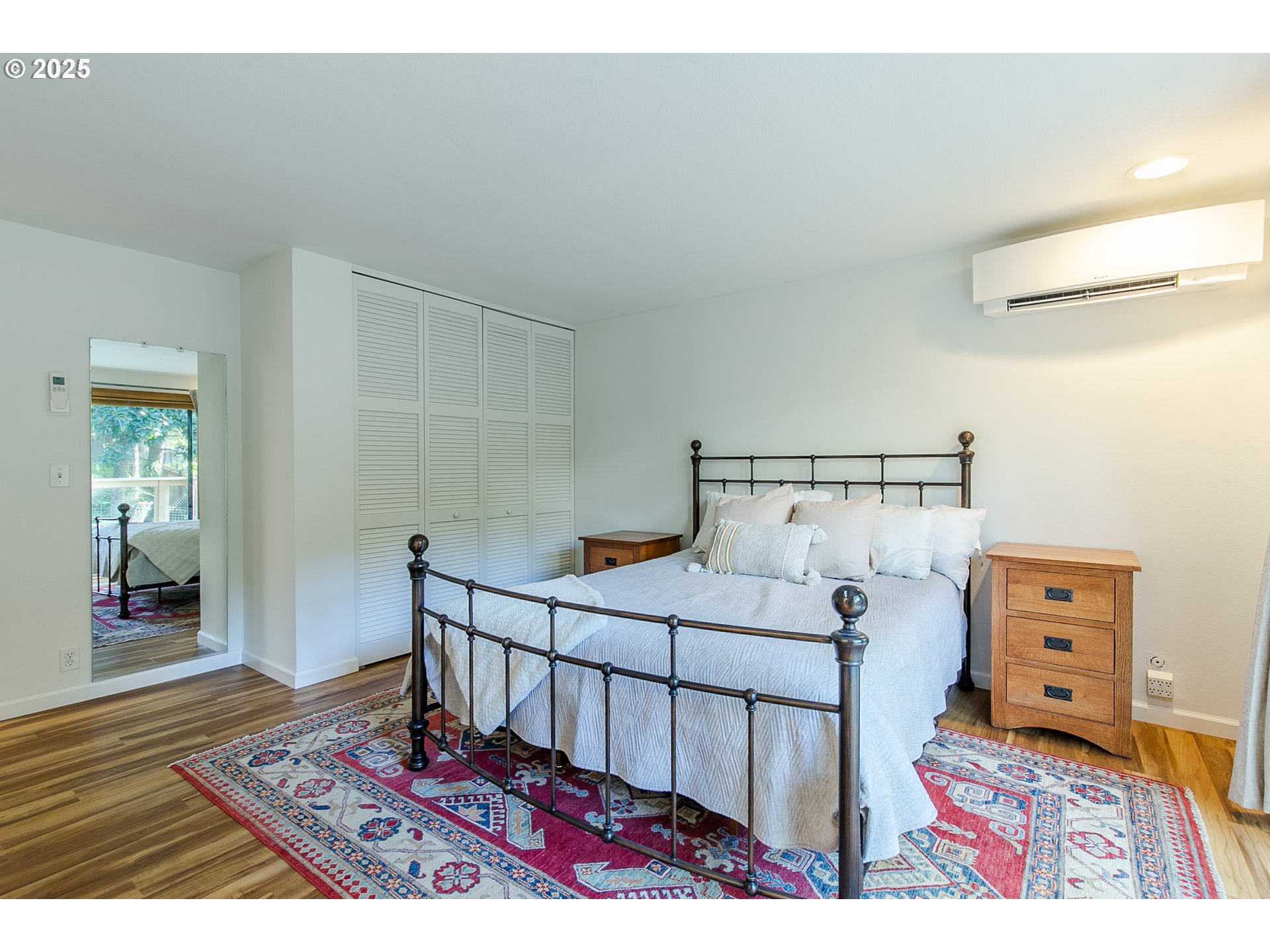 2724 Malibu Way Eugene, OR 97405 - Photo 28 of 48 a bedroom with a bed and wooden floor