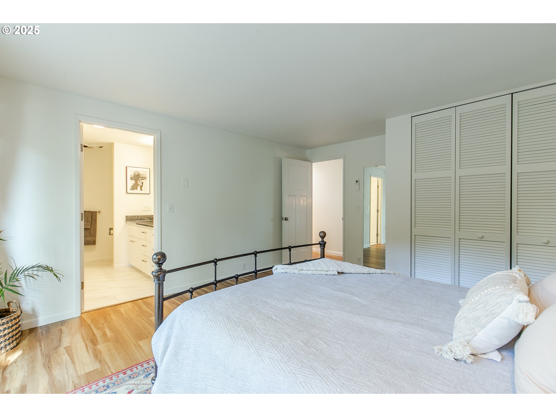 2724 Malibu Way Eugene, OR 97405 - Photo 29 of 48 a bedroom with a bed and a painting on the wall