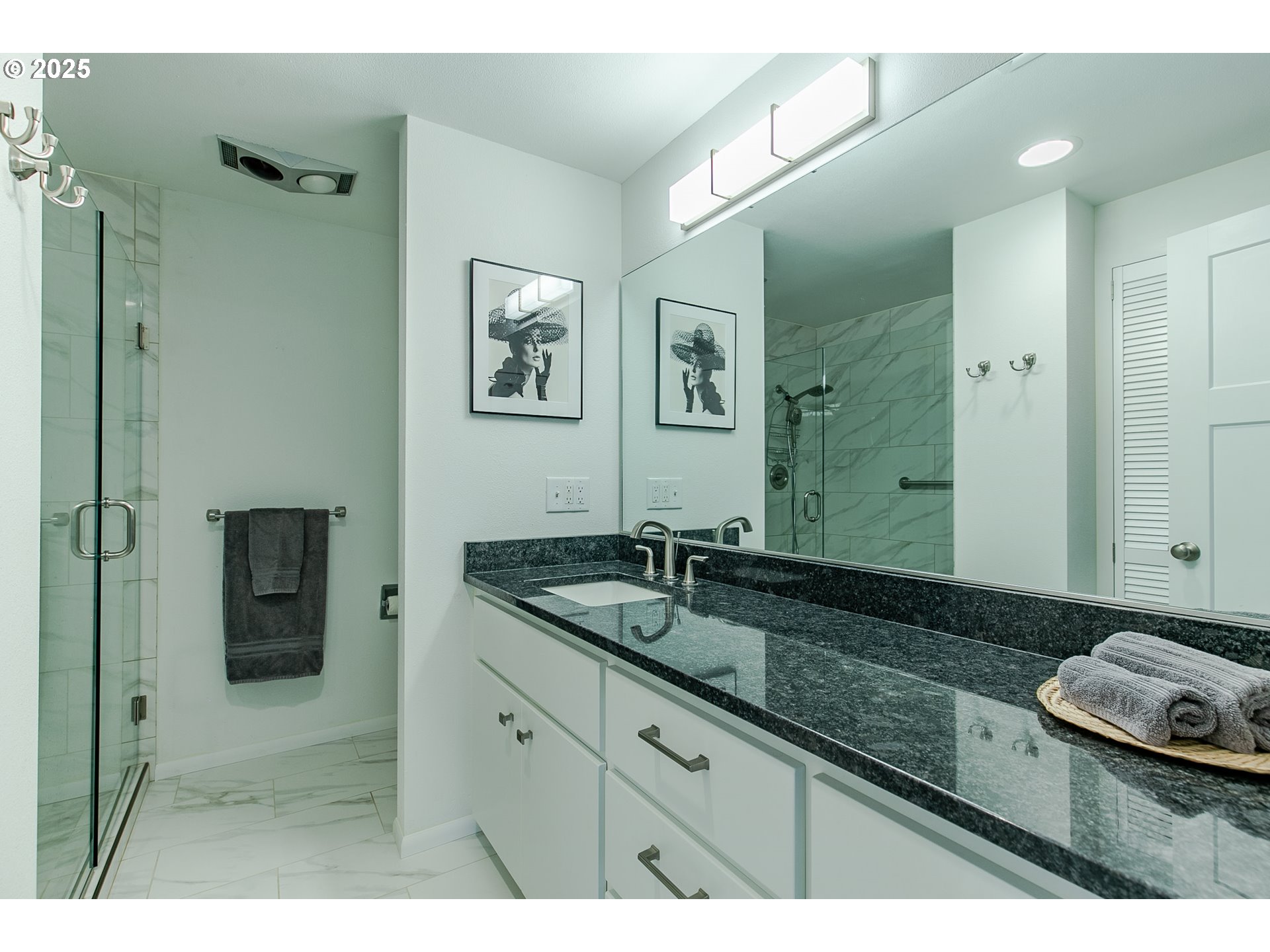 2724 Malibu Way Eugene, OR 97405 - Photo 31 of 48 a spacious bathroom with a granite countertop sink and a mirror