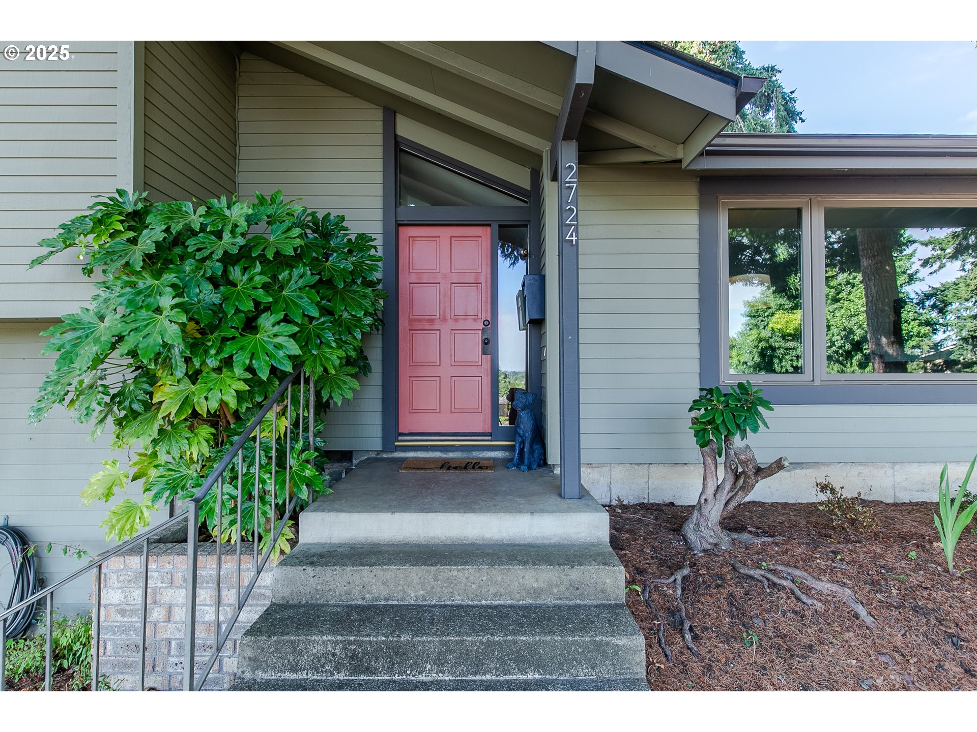 2724 Malibu Way Eugene, OR 97405 - Photo 4 of 48 a view of a house with potted plants