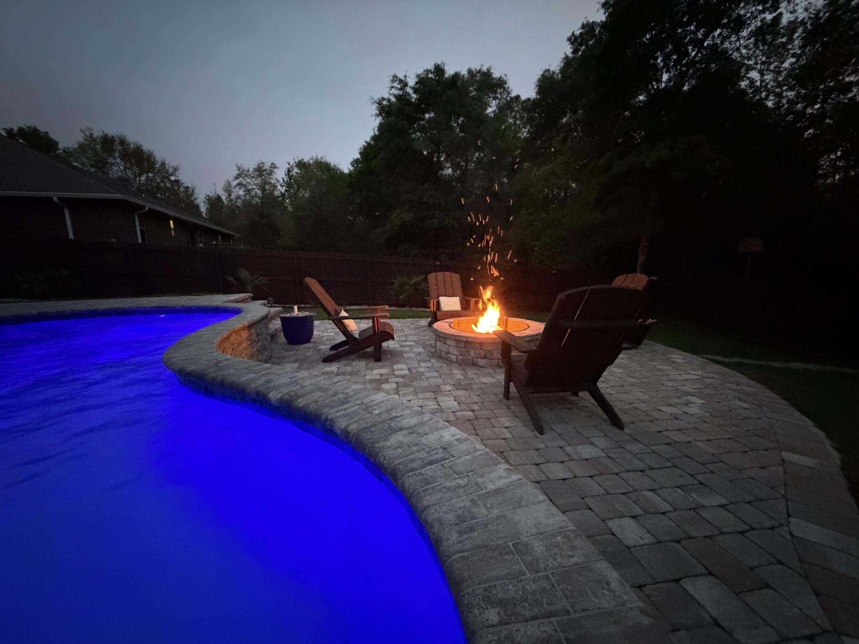 611 Terrier Trail Crestview, FL 32536 - Photo 11 of 64 a backyard of a house with table and chairs