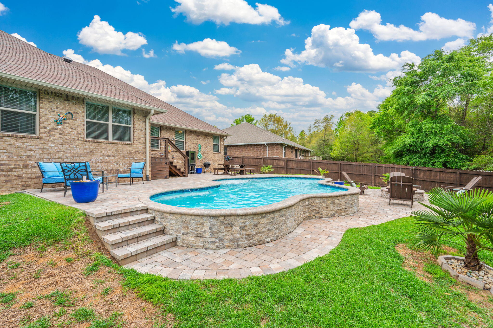 611 Terrier Trail Crestview, FL 32536 - Photo 14 of 64 a view of a house with backyard and sitting area