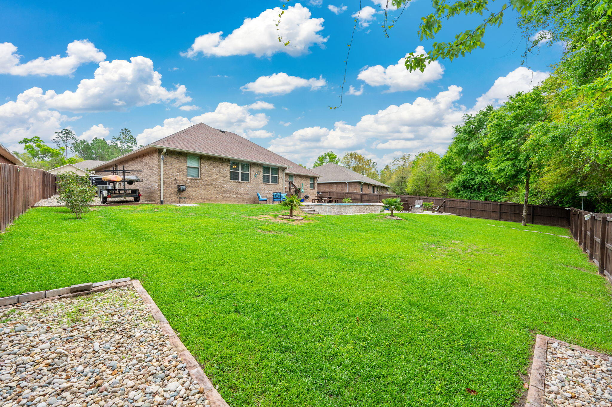 611 Terrier Trail Crestview, FL 32536 - Photo 16 of 64 a view of a house with a yard porch and sitting area