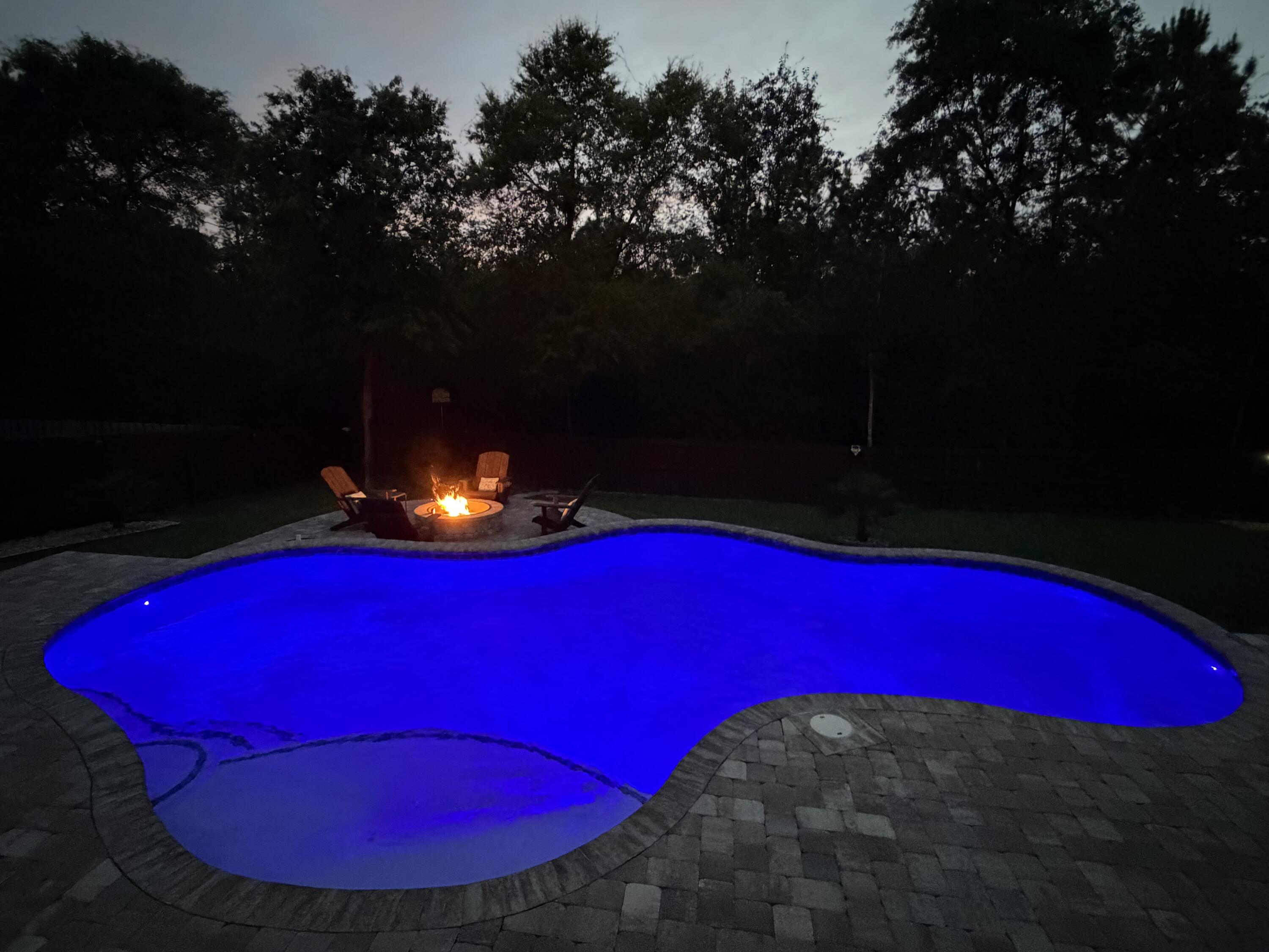 611 Terrier Trail Crestview, FL 32536 - Photo 21 of 64 a view of a red red and white house with a swimming pool