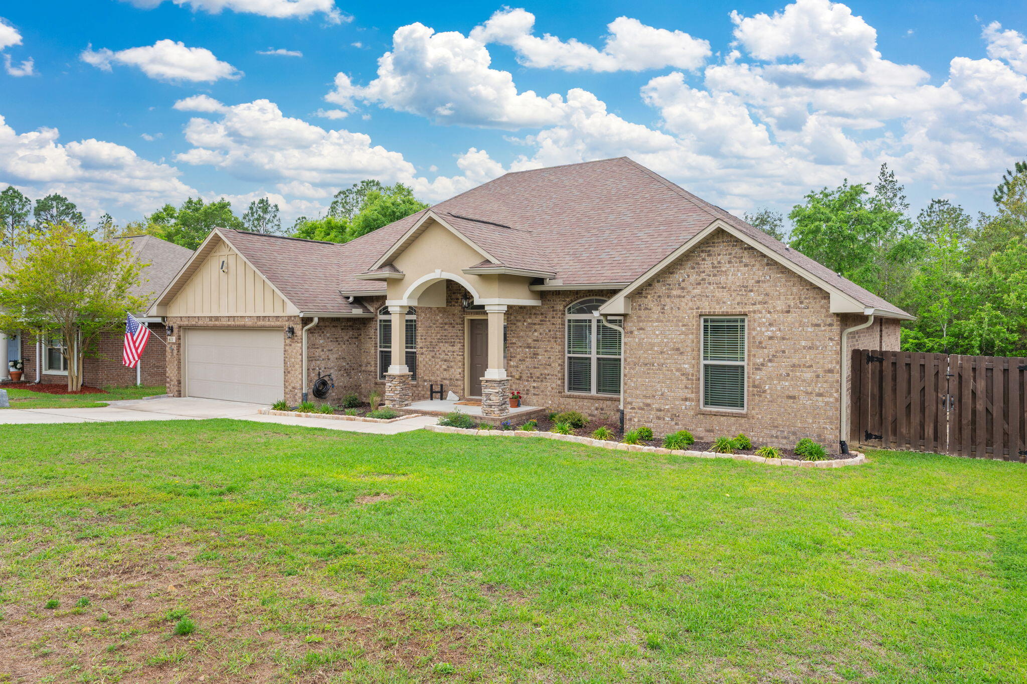 611 Terrier Trail Crestview, FL 32536 - Photo 22 of 64 a front view of house with yard and green space
