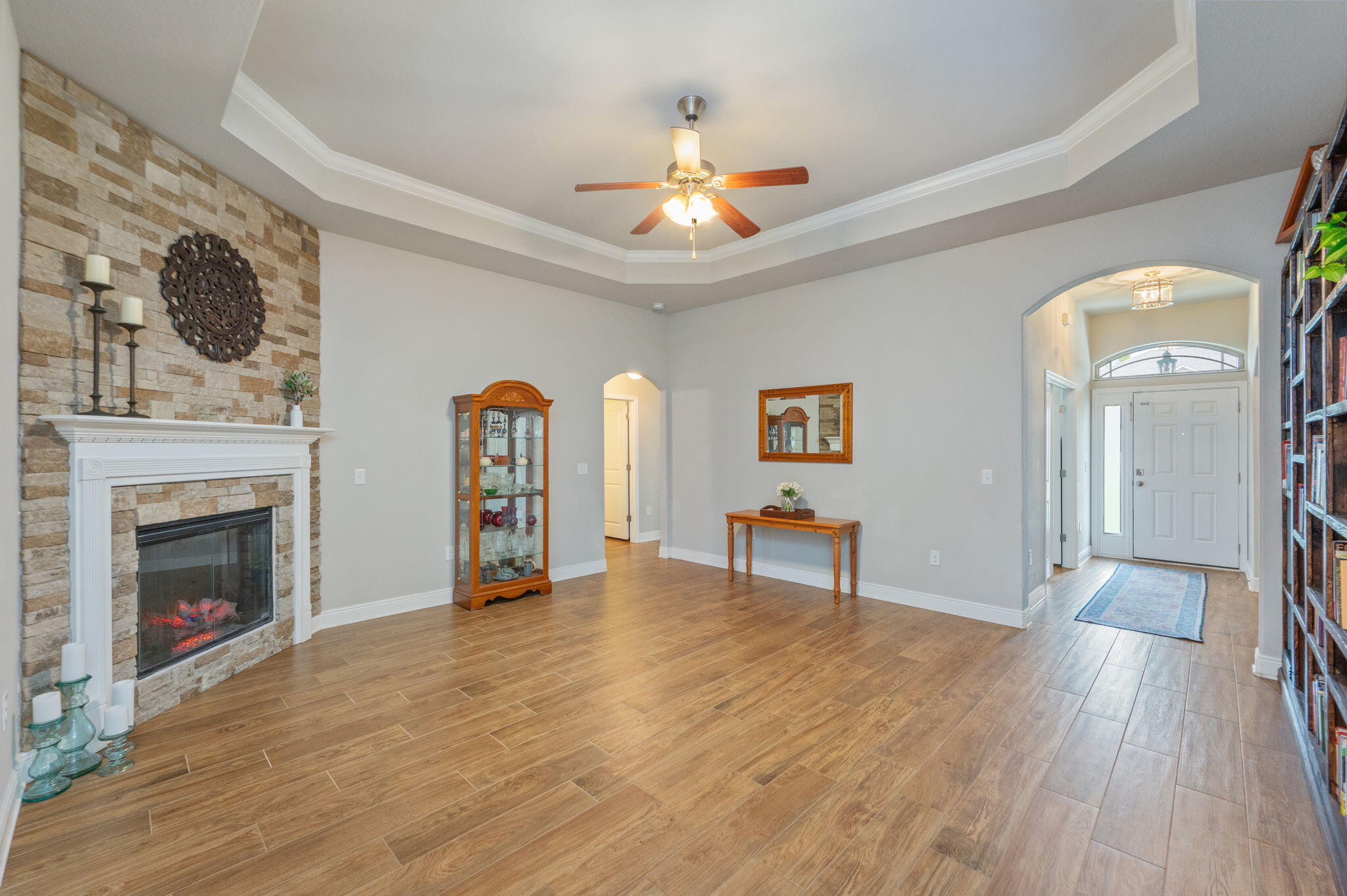 611 Terrier Trail Crestview, FL 32536 - Photo 30 of 64 a view of an empty room with wooden floor fireplace and a window