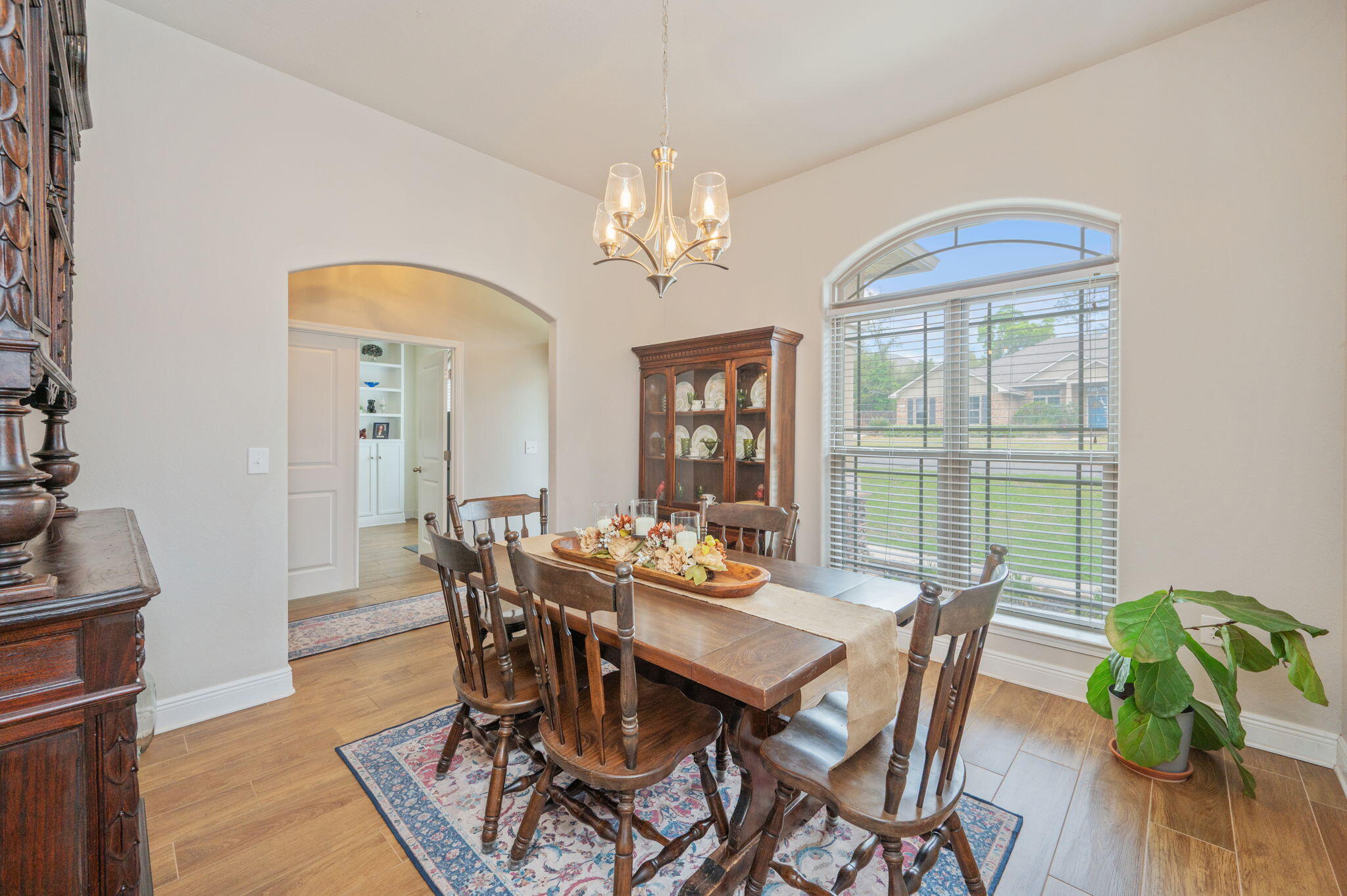 611 Terrier Trail Crestview, FL 32536 - Photo 32 of 64 a view of a dining room with furniture window and wooden floor