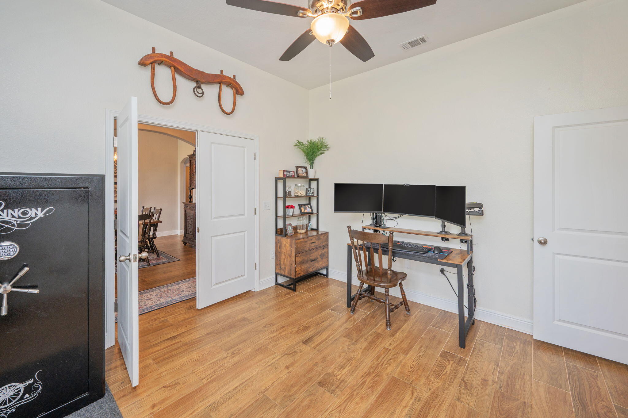 611 Terrier Trail Crestview, FL 32536 - Photo 35 of 64 a workspace with furniture and wooden floor