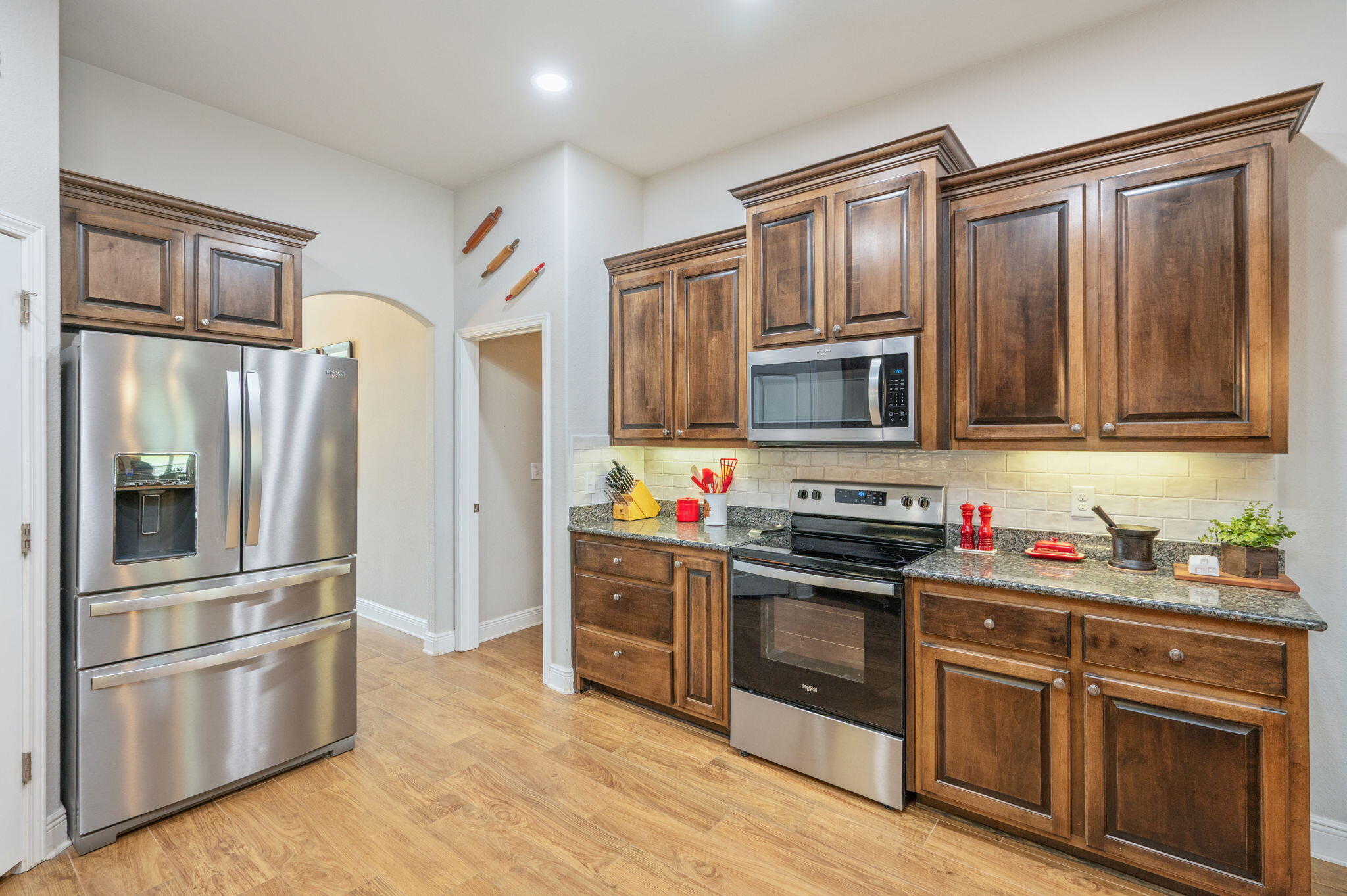 611 Terrier Trail Crestview, FL 32536 - Photo 37 of 64 a kitchen with stainless steel appliances granite countertop a refrigerator stove and sink