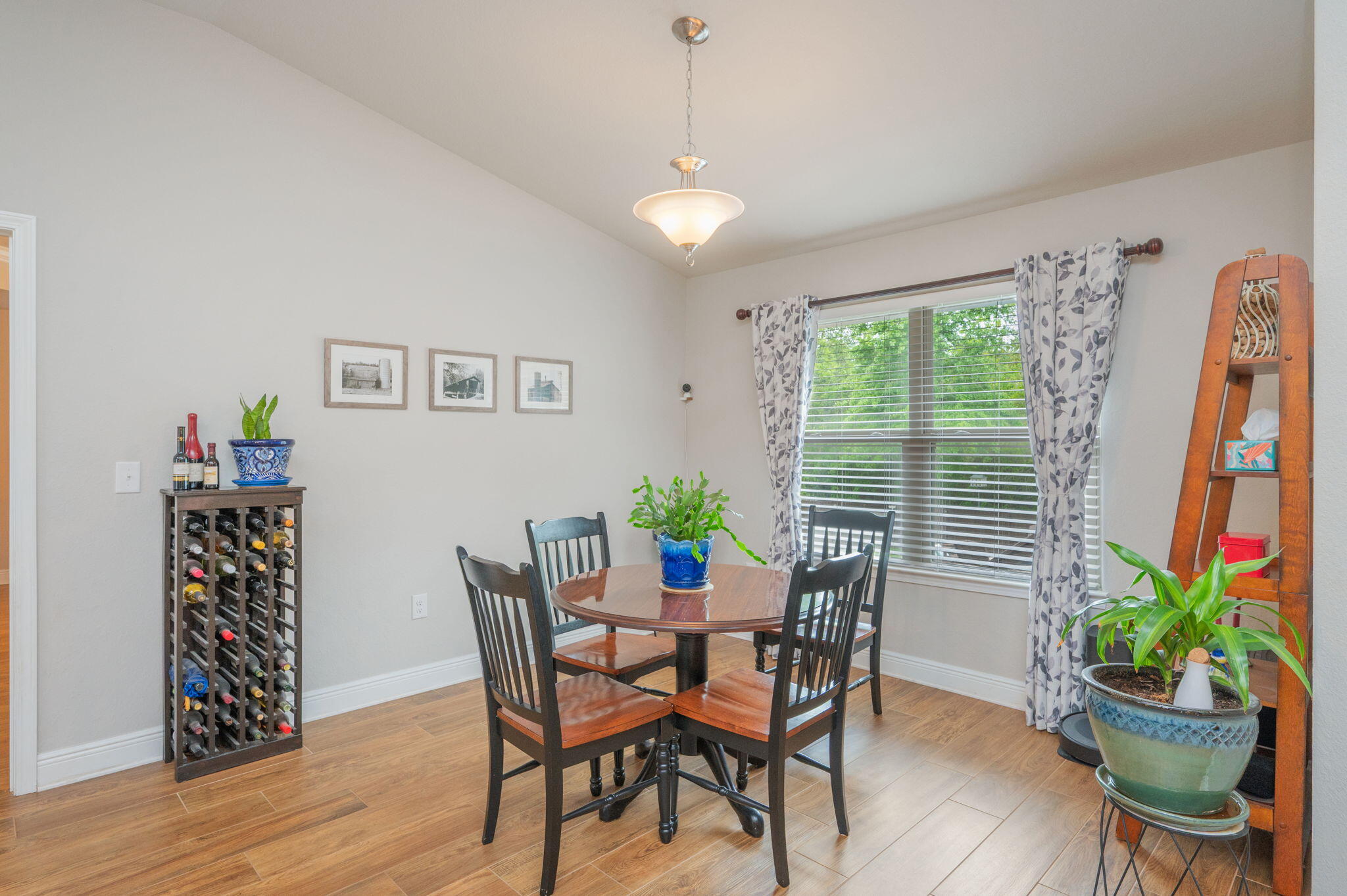 611 Terrier Trail Crestview, FL 32536 - Photo 39 of 64 a view of a dining room with furniture window and wooden floor