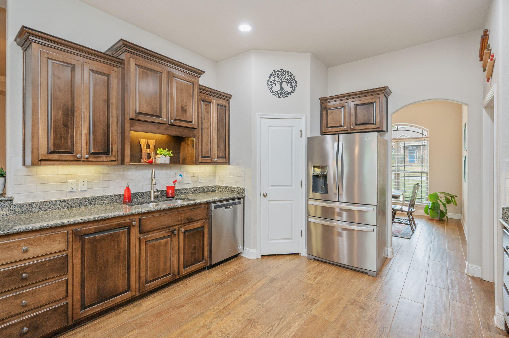 611 Terrier Trail Crestview, FL 32536 - Photo 40 of 64 a kitchen with granite countertop a refrigerator and a sink