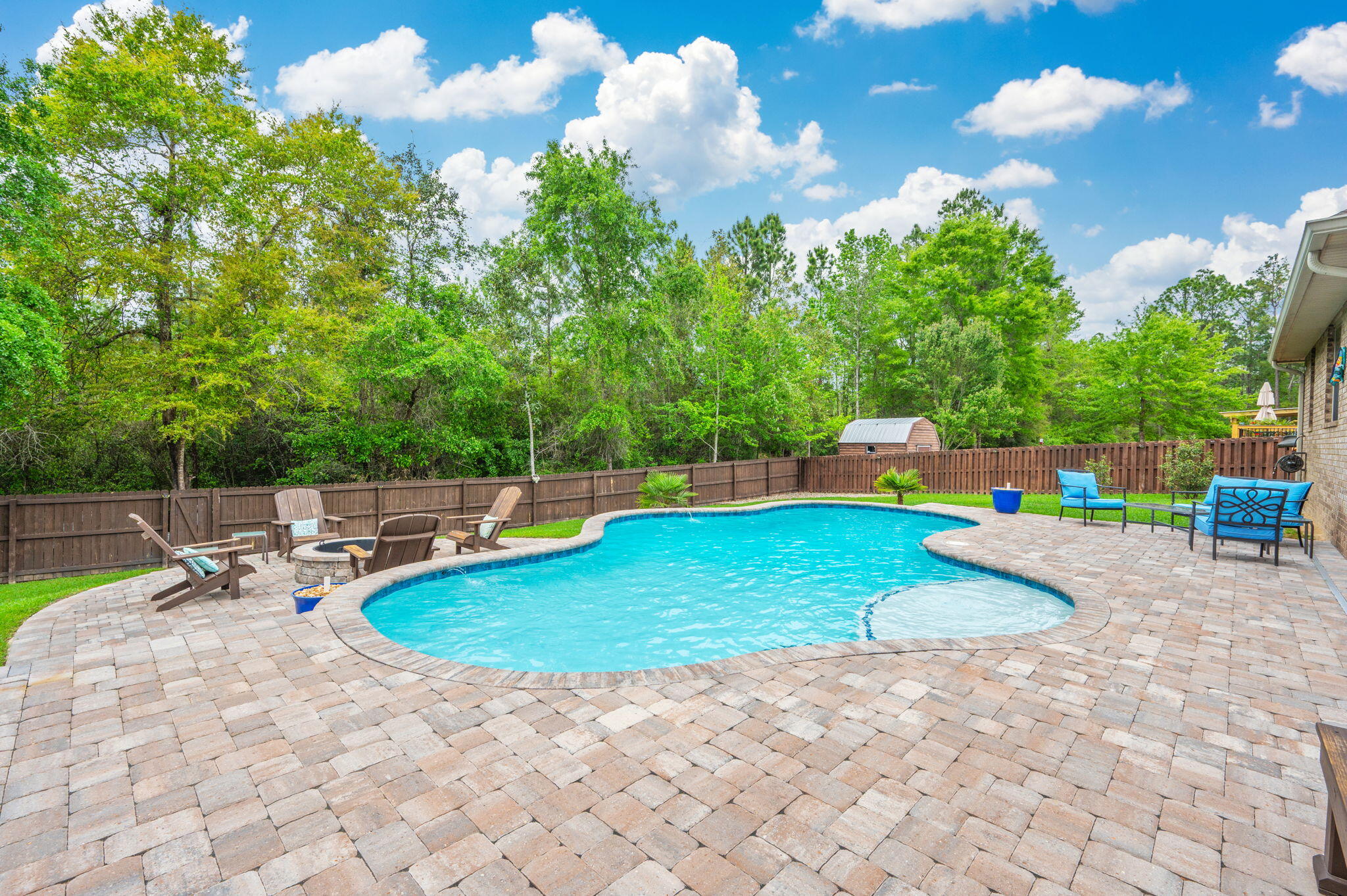 611 Terrier Trail Crestview, FL 32536 - Photo 4 of 64 a view of a backyard with swimming pool