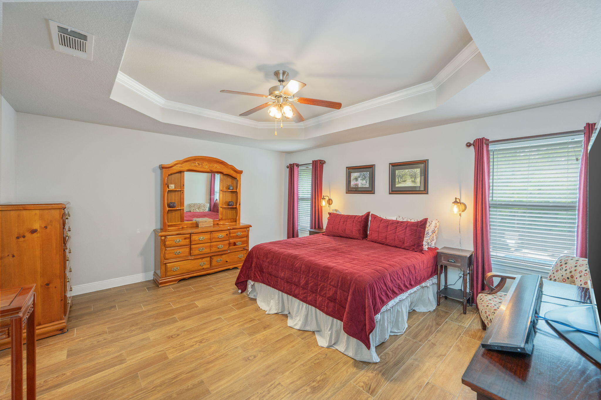 611 Terrier Trail Crestview, FL 32536 - Photo 43 of 64 a bedroom with a bed and a chandelier