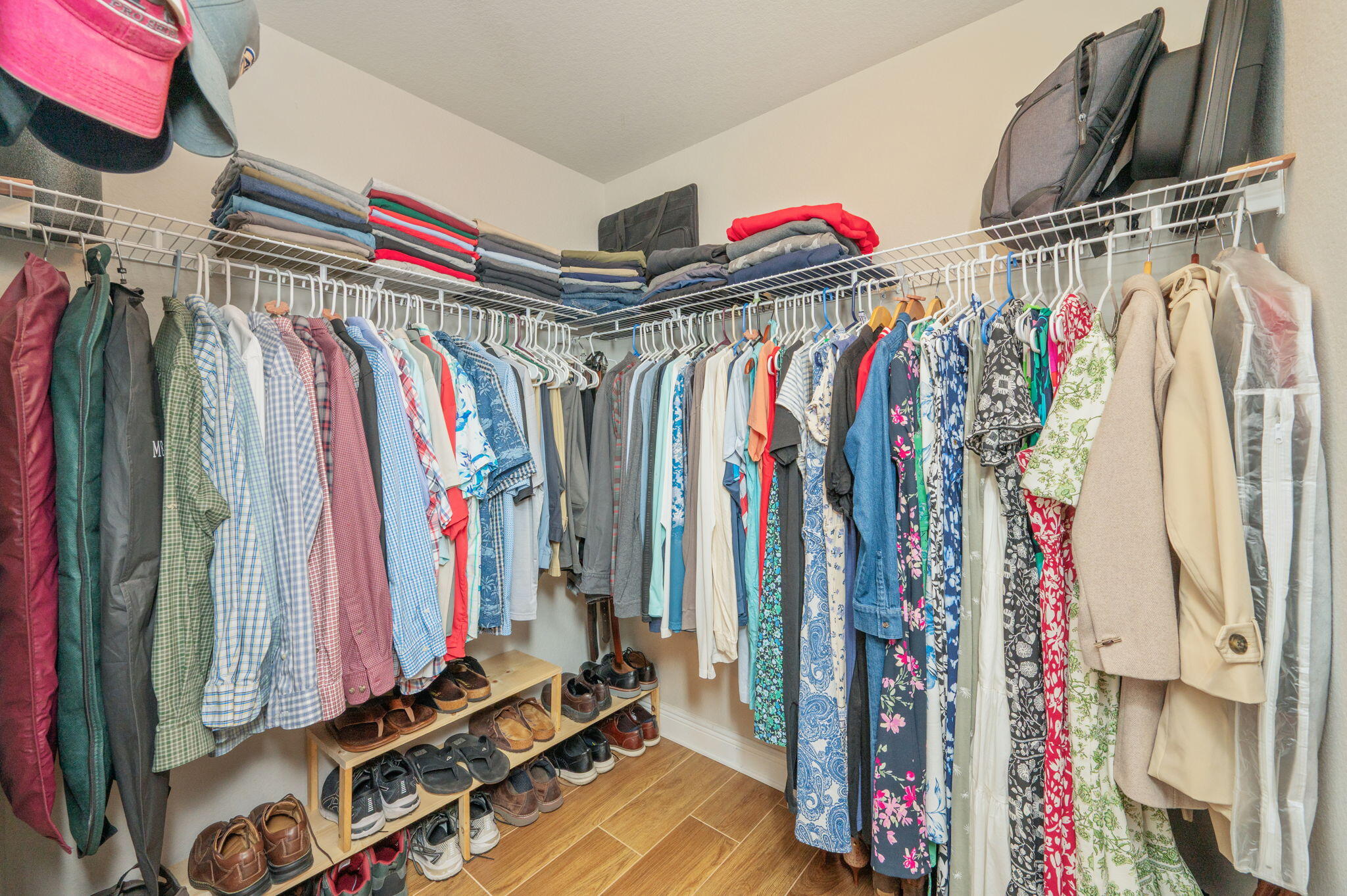 611 Terrier Trail Crestview, FL 32536 - Photo 46 of 64 a view of walk in closet with clothes