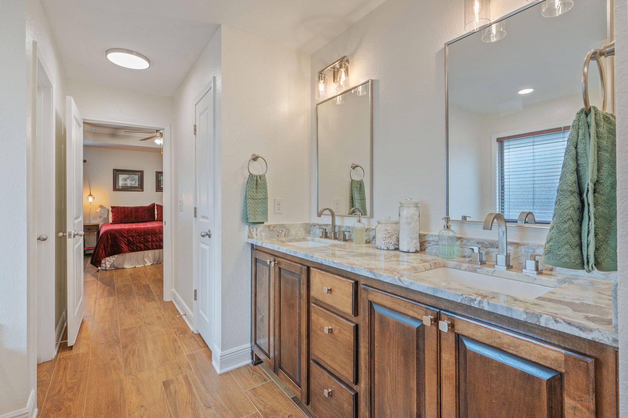 611 Terrier Trail Crestview, FL 32536 - Photo 48 of 64 a en suite bathroom with a granite countertop sink and a mirror