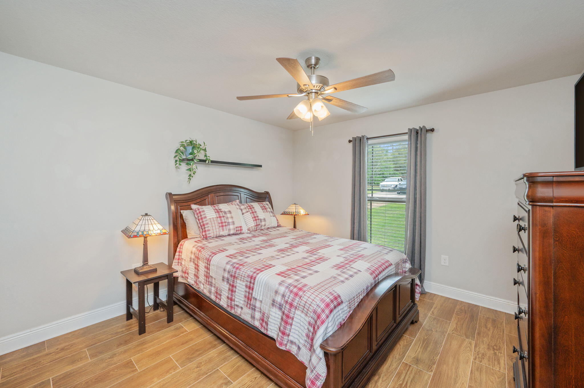 611 Terrier Trail Crestview, FL 32536 - Photo 51 of 64 a bedroom with a bed and a chandelier