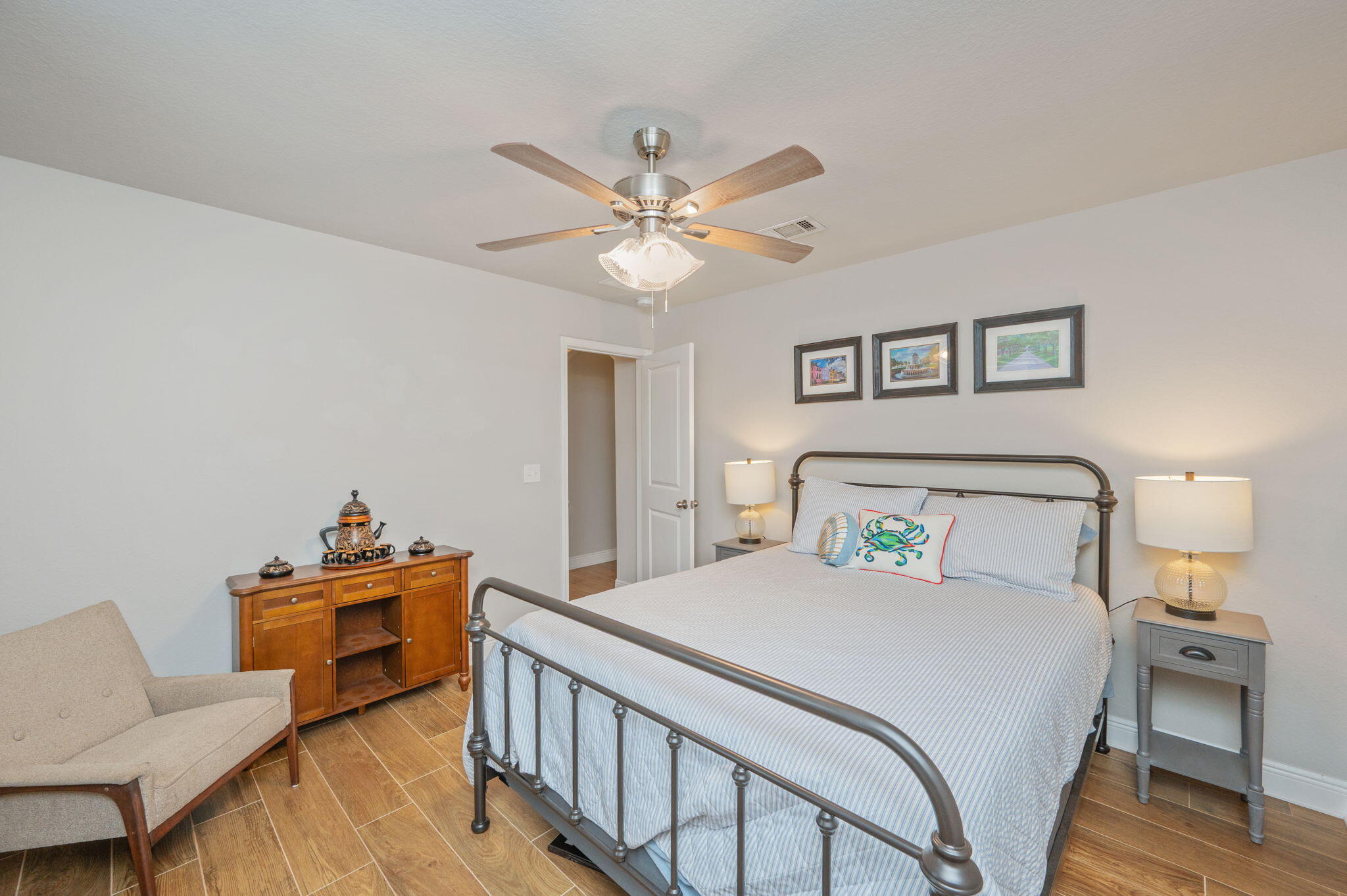 611 Terrier Trail Crestview, FL 32536 - Photo 52 of 64 a bedroom with a bed and a chandelier