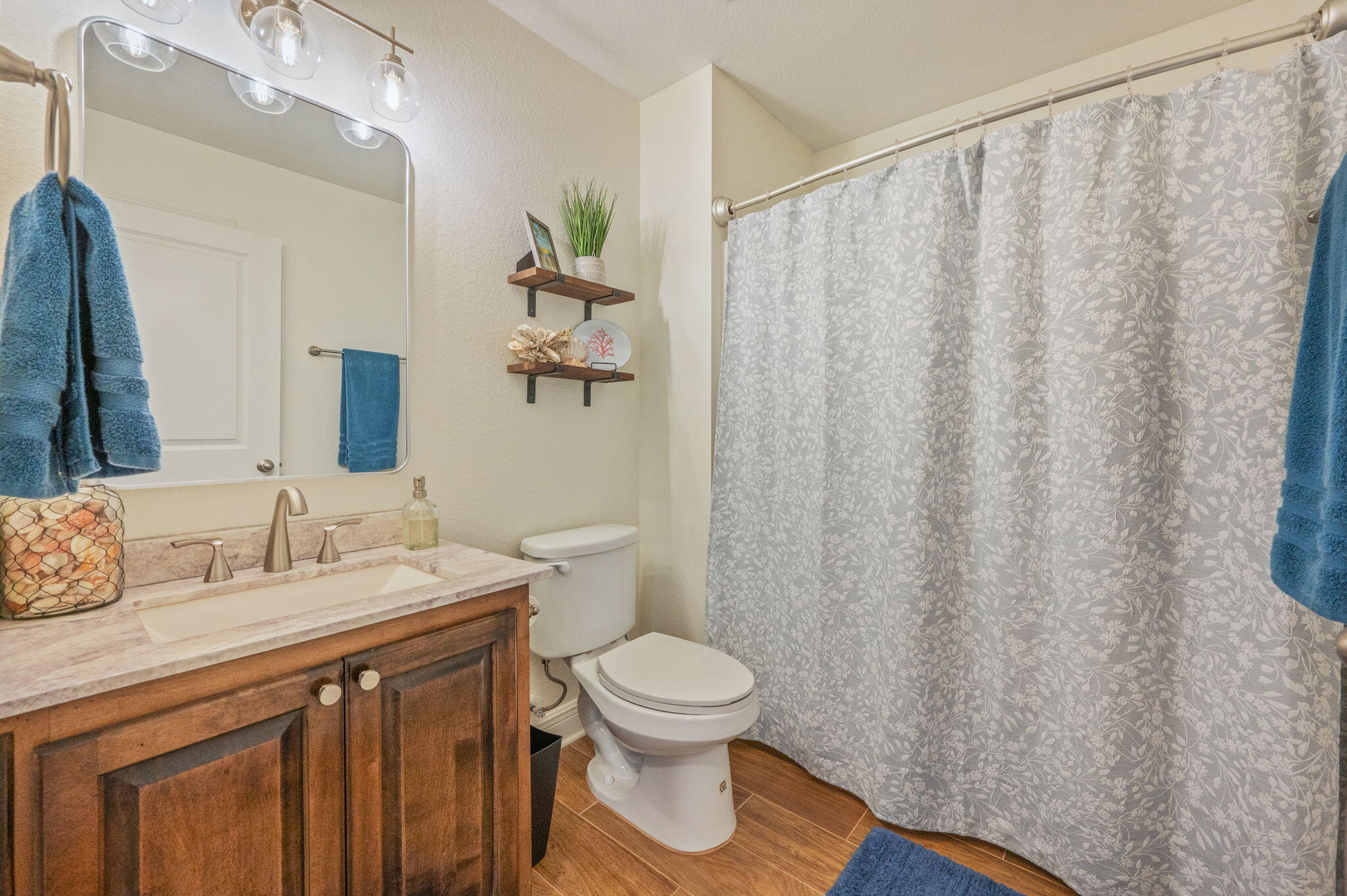 611 Terrier Trail Crestview, FL 32536 - Photo 54 of 64 a bathroom with a granite countertop sink and a mirror