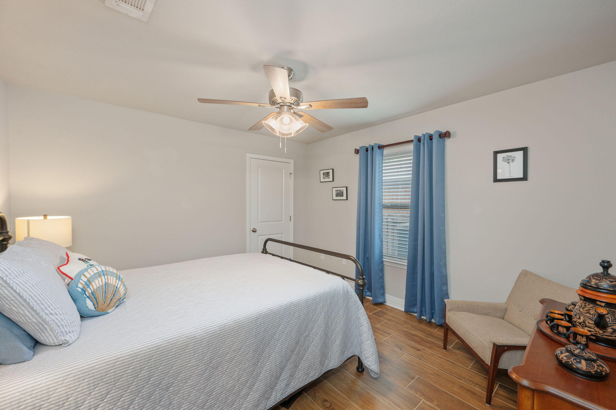 611 Terrier Trail Crestview, FL 32536 - Photo 55 of 64 a bedroom with a bed and a chandelier