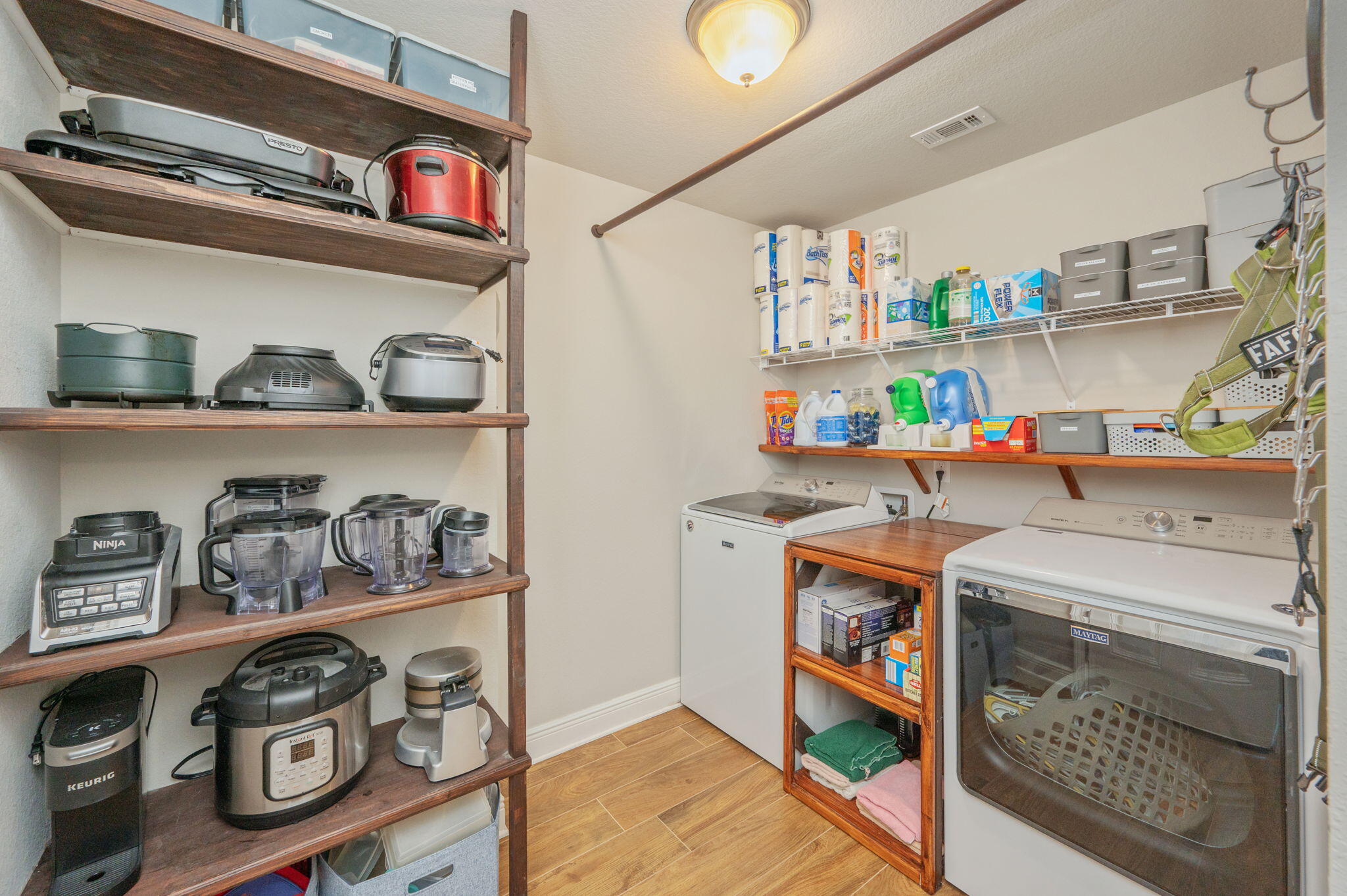 611 Terrier Trail Crestview, FL 32536 - Photo 57 of 64 a utility room with fridge dryer and washer
