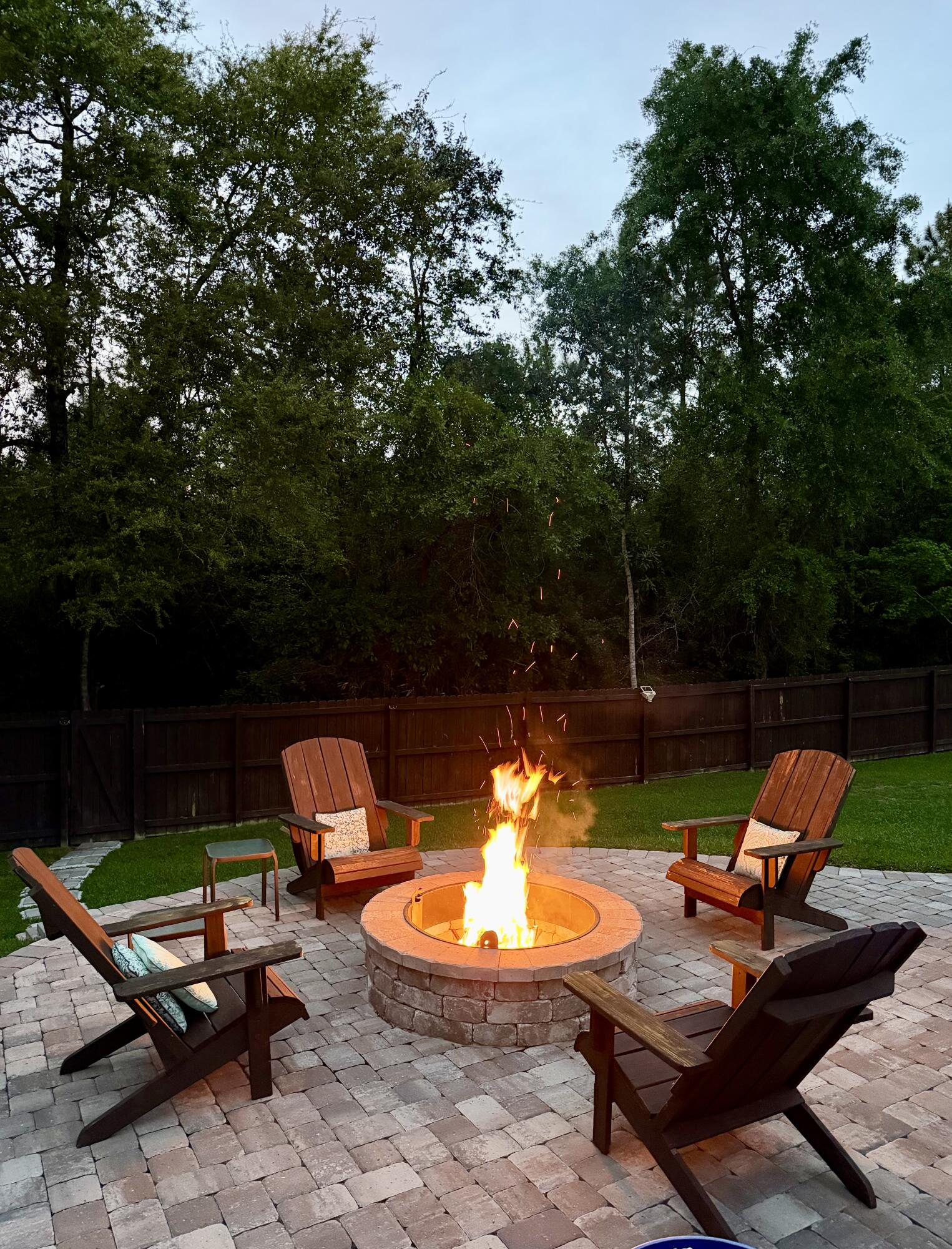 611 Terrier Trail Crestview, FL 32536 - Photo 7 of 64 a view of a swimming pool with lawn chairs and a fire pit