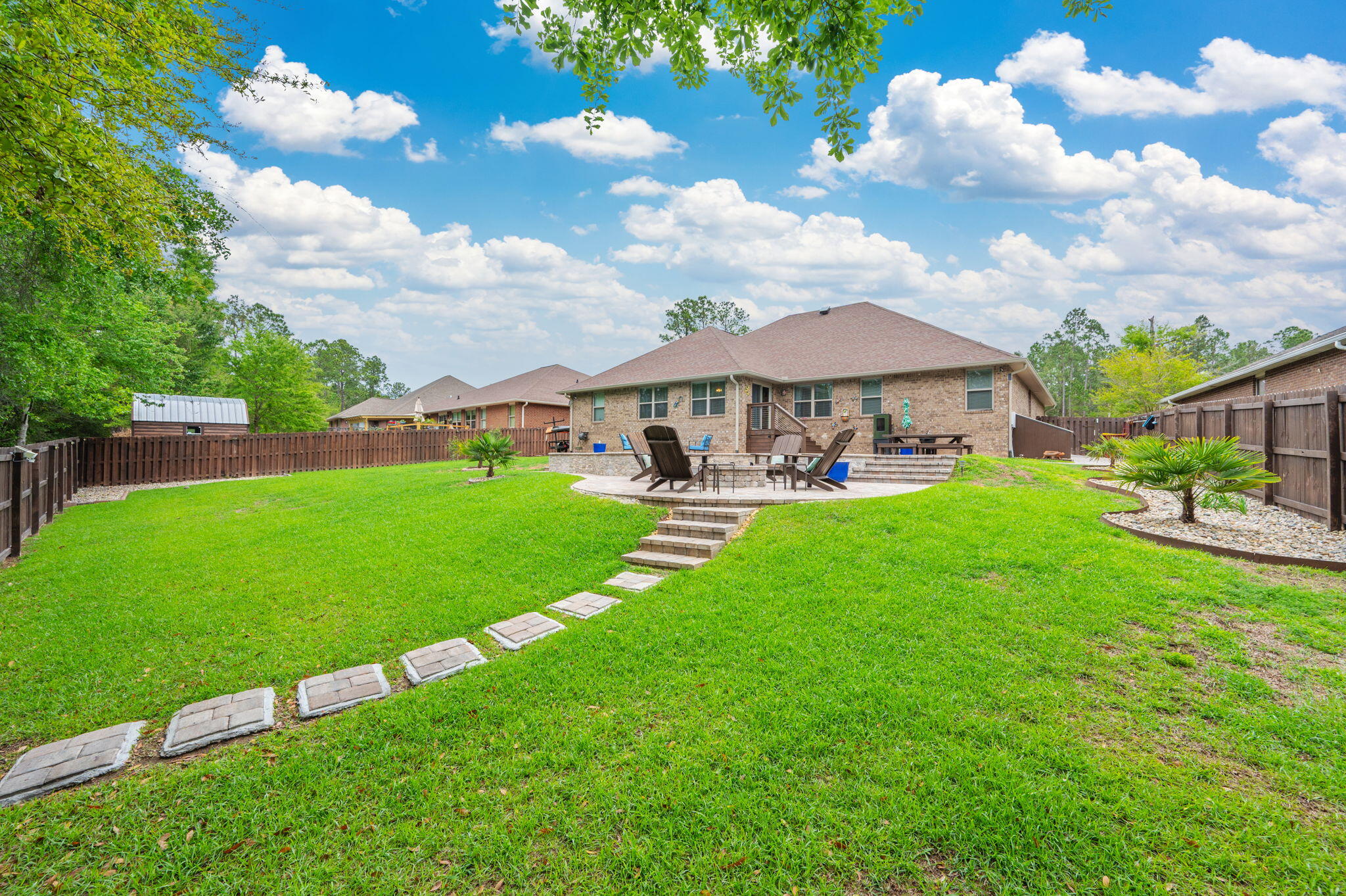 611 Terrier Trail Crestview, FL 32536 - Photo 8 of 64 a view of outdoor space with garden and patio