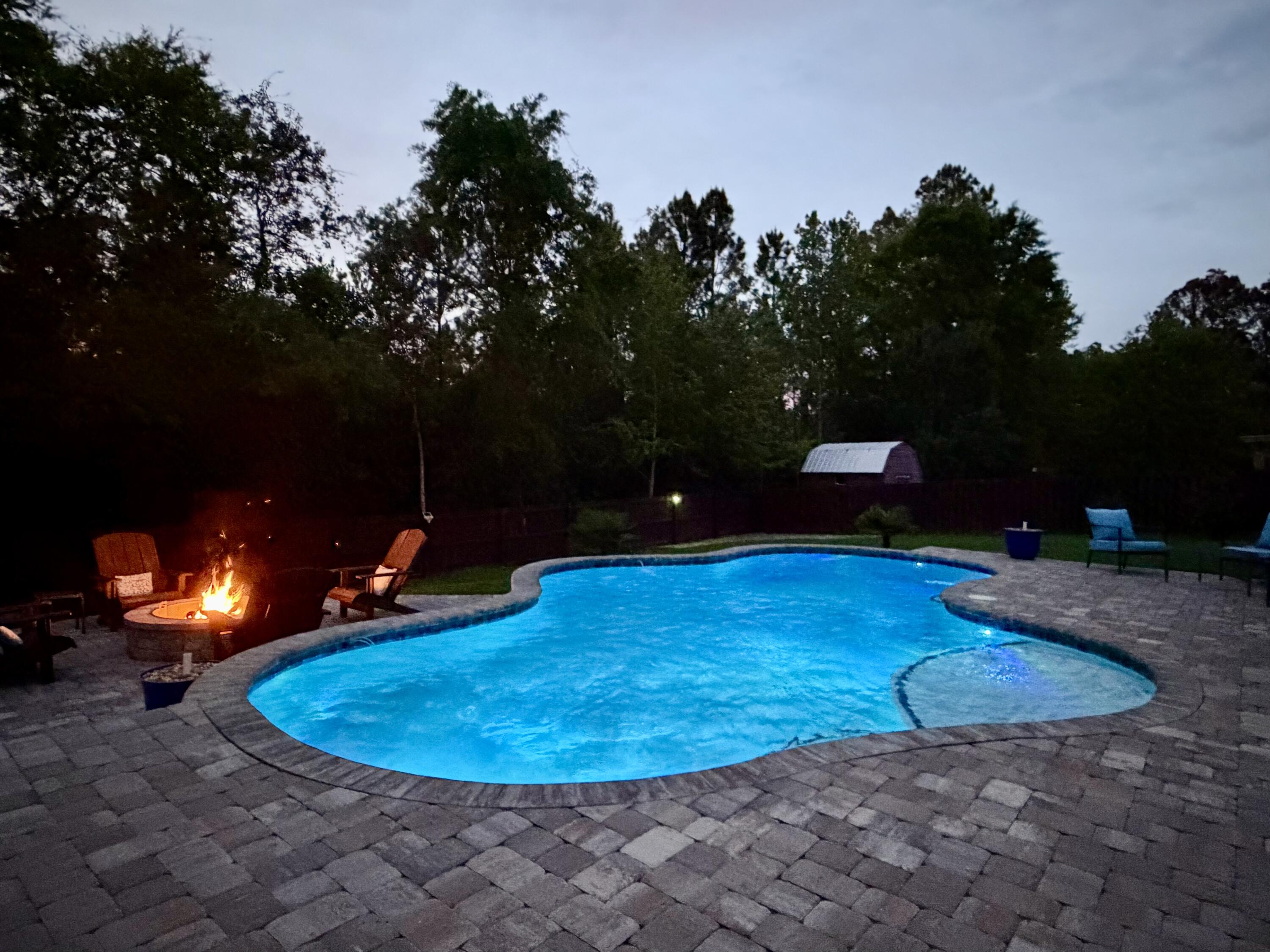 611 Terrier Trail Crestview, FL 32536 - Photo 9 of 64 a view of a swimming pool with a yard