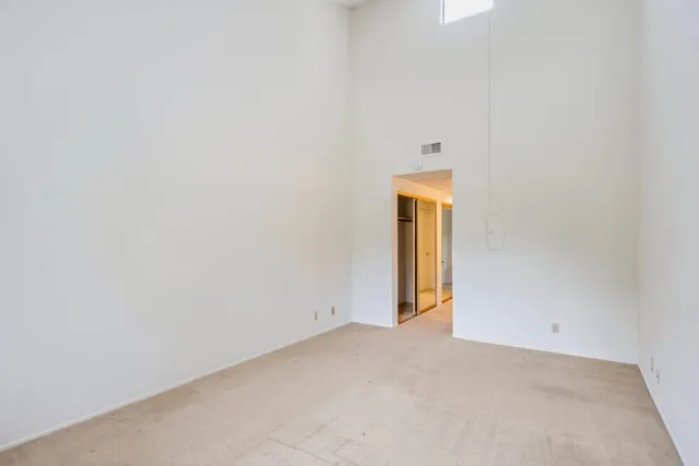 a spacious bathroom with a double vanity sink mirror and toilet