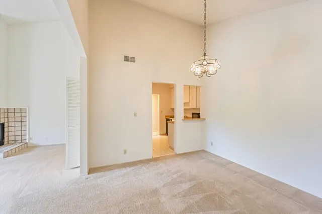 a view of empty room with a fireplace