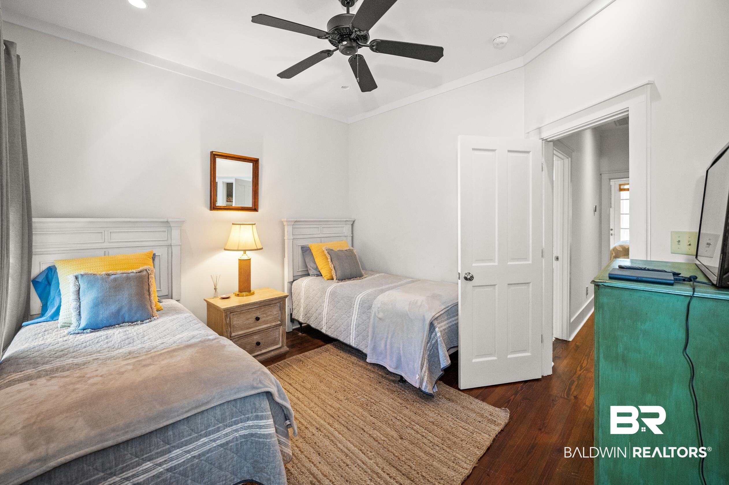 25773 Canal Road, Unit 28 Orange Beach, AL 36561 - Photo 23 of 48 Bedroom featuring dark wood-style flooring, ornamental molding, and a ceiling fan