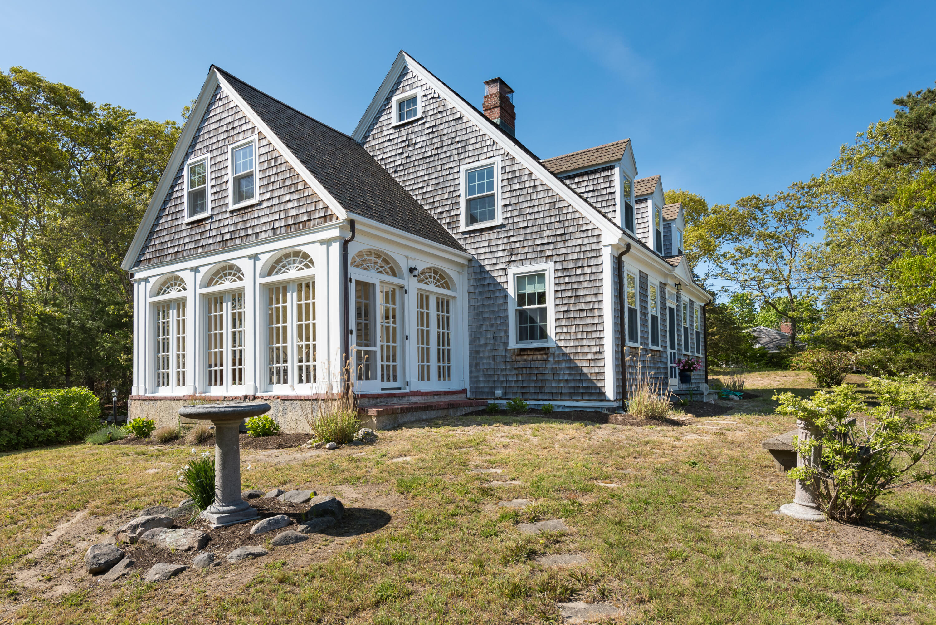 a front view of a house with a yard